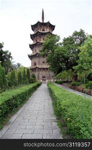 Old stone buddhist pagoda in the park, Quanzhou, China