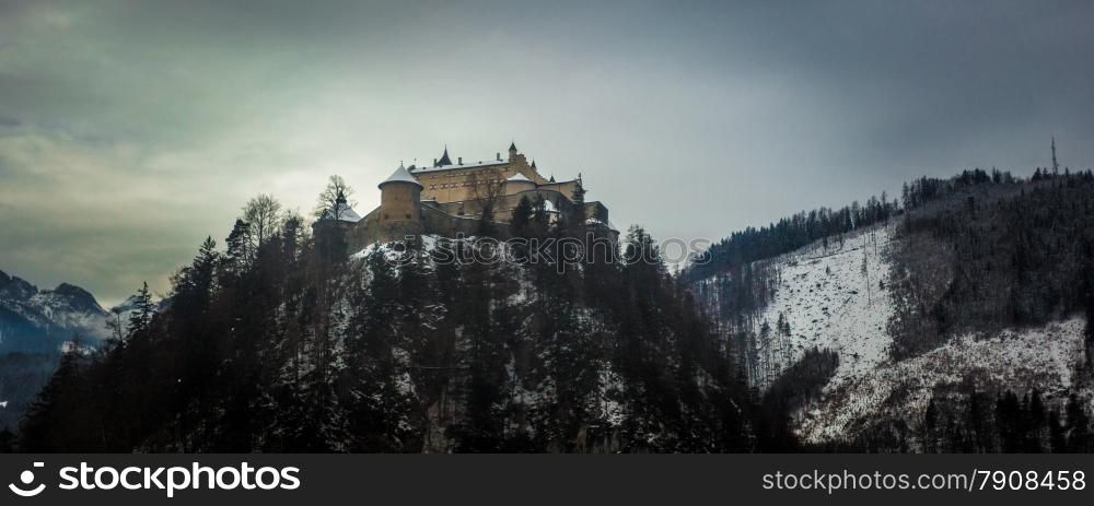 Old stone castle standing on high mountain at Austrian Alps