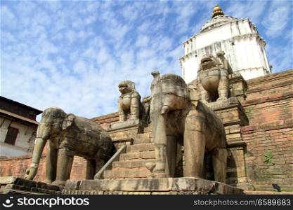 Old stone elephants and brick piramid in Bhaktapur, Nepal