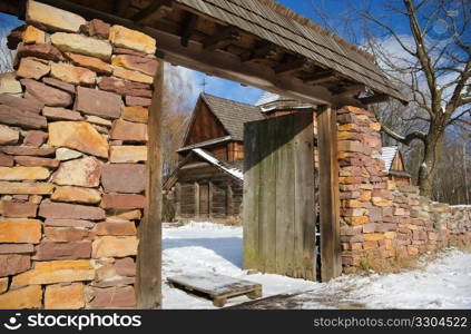 old stone fence with a gate built of granite