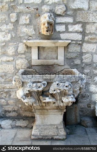 Old stone fountainl in the center of Split, Croatia