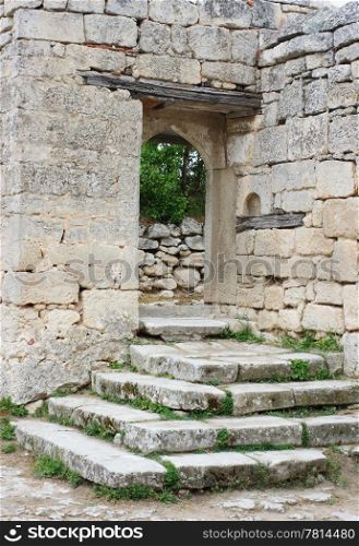 Old stone gate of the courtyard Chufut-kale, Bakhchisaray, Crimea, Ukraine XIV centuries