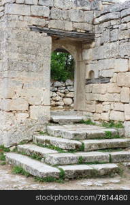 Old stone gate of the courtyard Chufut-kale, Bakhchisaray, Crimea, Ukraine XIV centuries