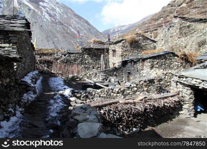 Old stone houses on the street in Samdo in Nepal