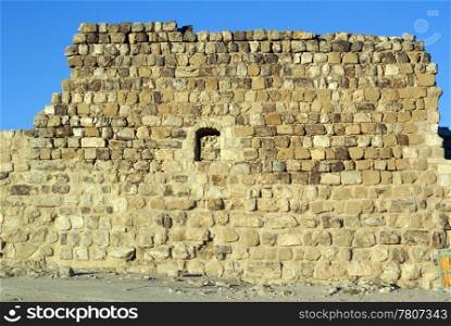 Old stone wall and ruins in castle Karak, Jordan