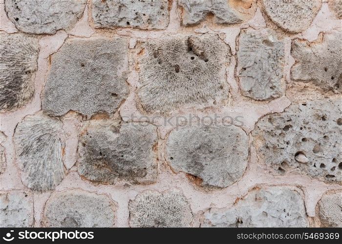 Old stone wall of limestone
