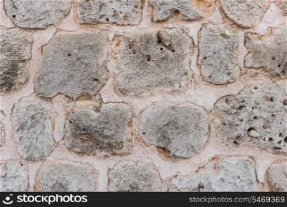 Old stone wall of limestone