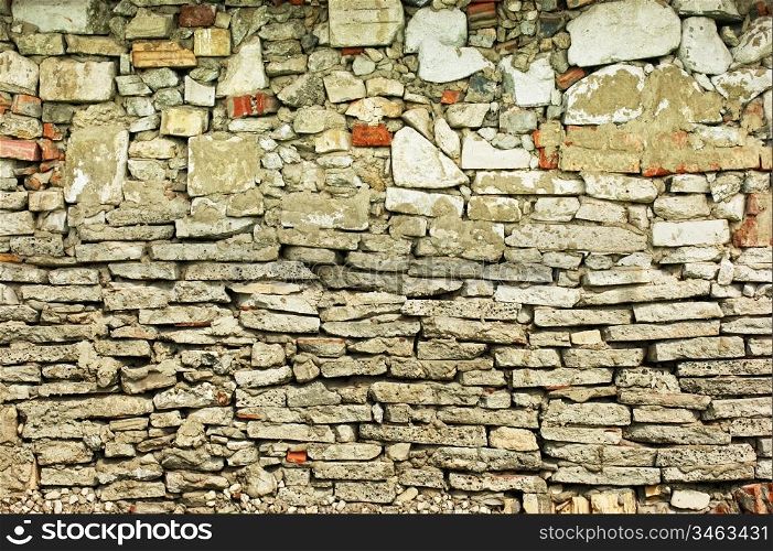 old stone wall of the house