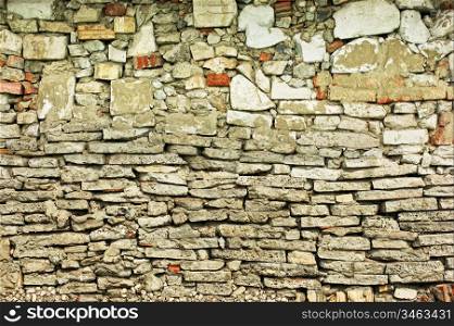 old stone wall of the house