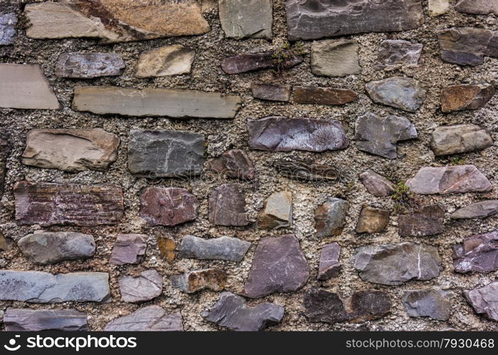 old stone wall. pattern of decorative slate stone wall surface. Abstract background of stone wall texture