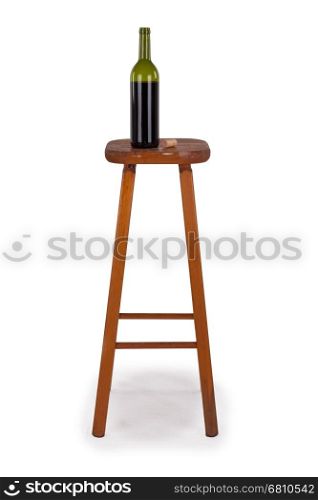 Old stool and bottle of wine isolated on white background, concept of alcohol addiction