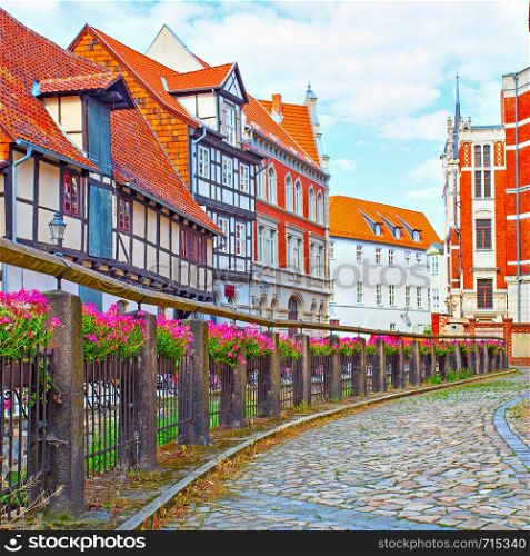 Old street along small river in Quedlinburg, Germany