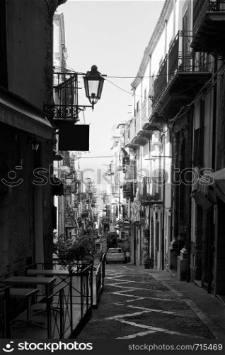 Old street in Cefalu, Sicily, Italy. Black an white cityscape