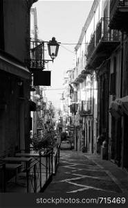 Old street in Cefalu, Sicily, Italy. Black an white cityscape