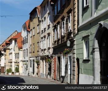 Old street in Ljubljana, Slovenia, converging in perspective. Old street in European town converging in perspective
