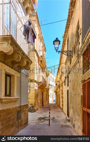 Old street in the Old City of Syracuse in Sicily, Italy - Italian cityscape