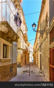Old street in the Old City of Syracuse in Sicily, Italy - Italian cityscape