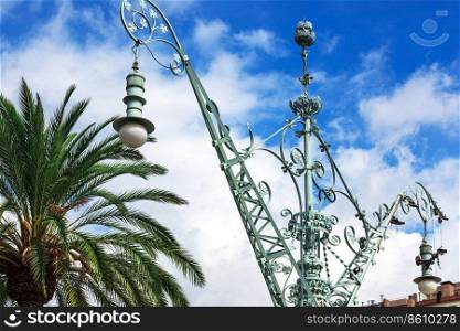 old street lamp and palm tree