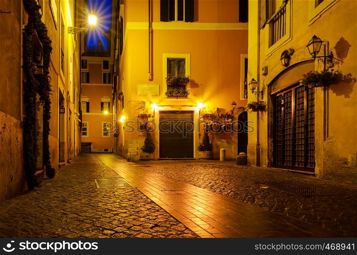 Old street of Rome at night in Italy