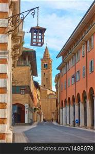 Old street with church in the end in the old town of Cesena, Emilia-Romagna, Italy