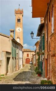 Old street with old bell tower in Santarcangelo di Romagna town, Rimini province, Italy