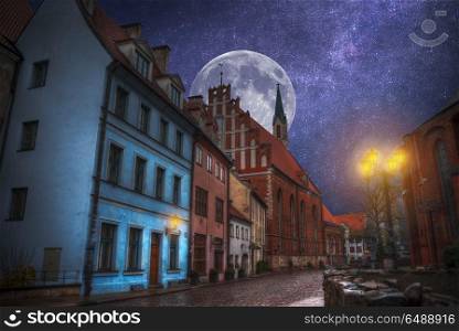 old streets of Night Riga. Lights, stars and the moon shine. old streets of Riga night.