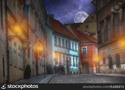 old streets of Prague night. Lights, stars and the moon shine. old streets of Prague night.
