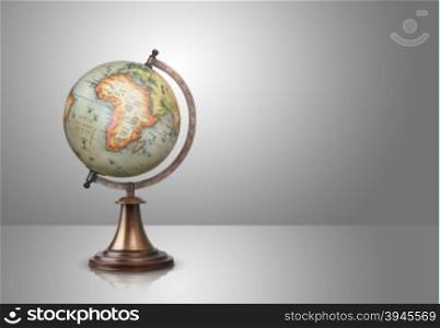 old style globe on gray background