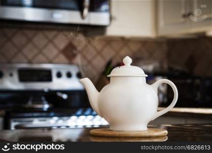 Old style teapot at modern kitchen interior