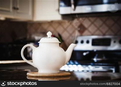Old style teapot at modern kitchen interior