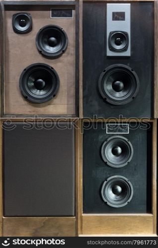 Old Style Wooden Electronic Music Speakers Stacked Next To Each Other
