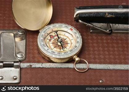old suitcase and compass
