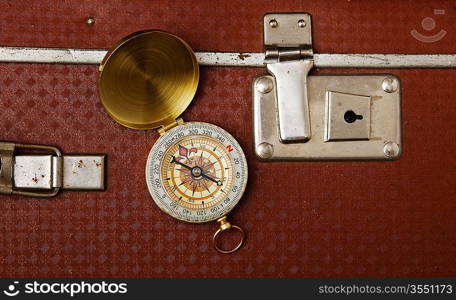 old suitcase and compass