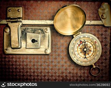 old suitcase and compass