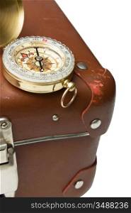 old suitcase and compass isolated on white background
