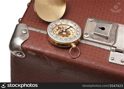 old suitcase and compass isolated on white background