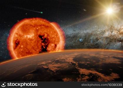 Old Sun over the dark planet Earth. A new star is born in the universe. A comet runs in the space. Elements of this image furnished by NASA