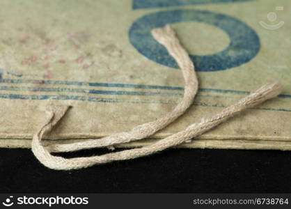 Old tattered folder tied with rope