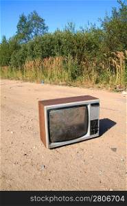 old television set on rural road