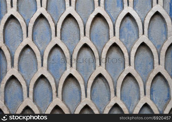 Old textured wall with geometric pattern abstract background.