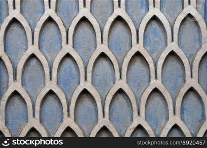 Old textured wall with geometric pattern abstract background.