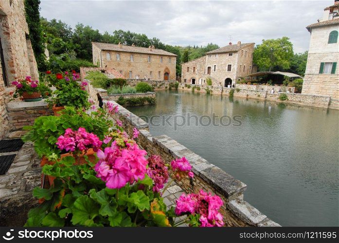 old thermal baths in the medieval village Bagno Vignoni, Tuscany, Italy
