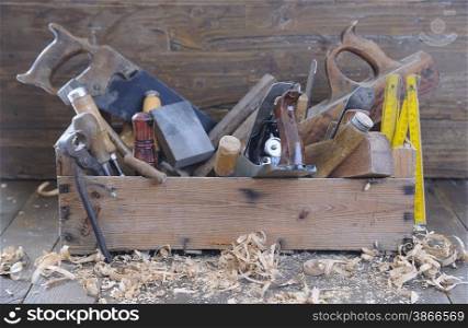 Old toolbox on the workbench in a carpentry