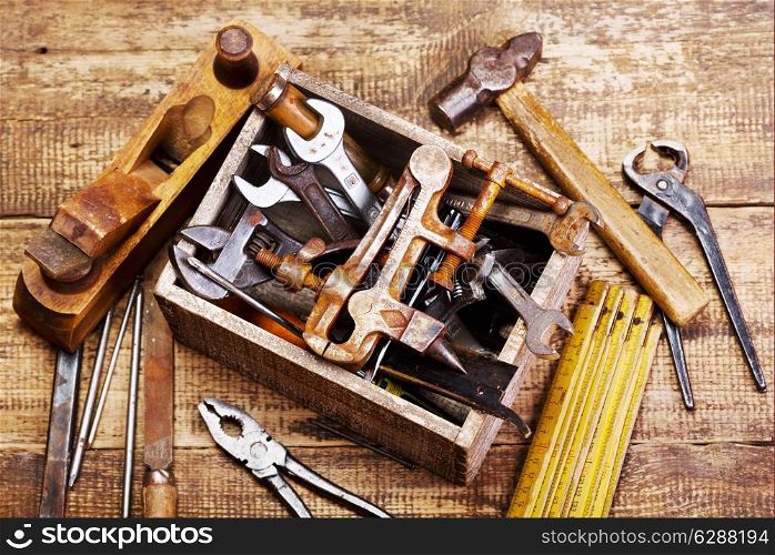 old tools on wooden background