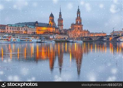 Old Town and Elba at night in Dresden, Germany. Dresden Cathedral of the Holy Trinity or Hofkirche, Bruehl&rsquo;s Terrace or The Balcony of Europe, Semperoper and Augustus Bridge with reflections in the river Elbe at snowy christmas night in Dresden, Saxony, Germany