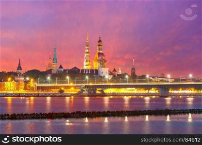 Old Town and River Daugava at night, Riga, Latvia. Old Town of Riga and River Daugava at beautiful sunset, Riga Cathedral, Saint Peter church and Riga castle in the background, Latvia