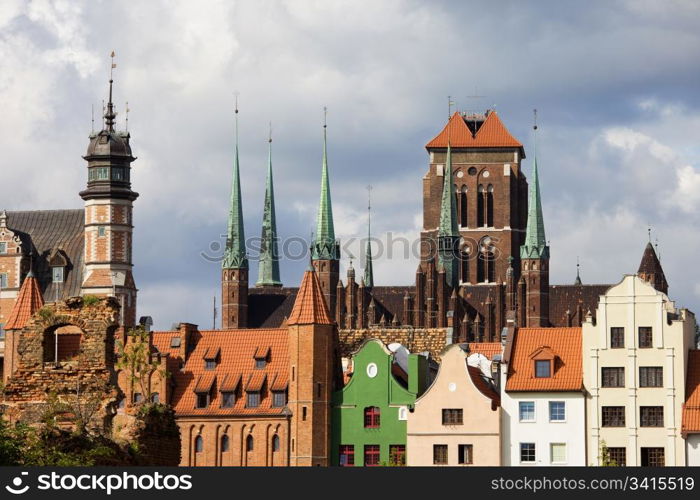 Old Town architecture with Church of the Blessed Virgin Mary (Polish: Bazylika Mariacka) in the background in Gdansk (Danzig), Poland