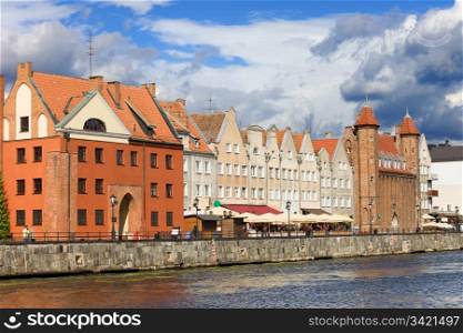 Old Town by the Motlawa river in Gdansk, Poland, Swietojanska Gate on the left, Straganiarska Gate on the right side of the image