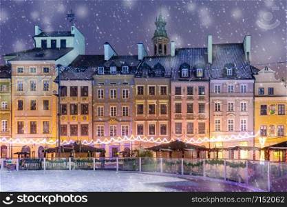 Old Town Market Place with colorful houses during snowy morning blue hour, Warsaw, Poland.. Old Town Market Place in morning, Warsaw, Poland.