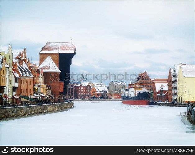 Old Town of Gdansk (Danzig) in Poland with Motlava river and the Crane (Polish: Zuraw). Winter scenery